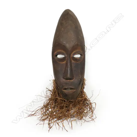 An African Dan passport mask with pierced eyes and mouth,